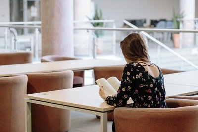 HRMS learning management module - woman reading HRMS learning management module - woman reading