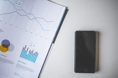 HRMS analytics - phone with graphs HRMS analytics - phone with graphs