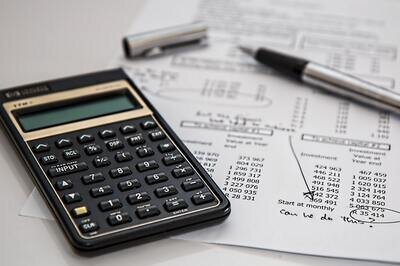 HRMS budget - calculator and pen