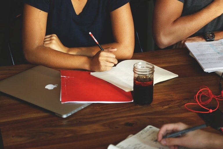 HRMS LMS integration -  woman with laptop