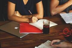 HRMS LMS integration -  woman with laptop