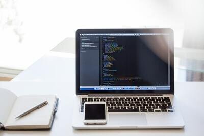 automated testing solutions hrms - laptop with code
