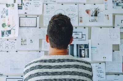 cloud hrms implementation - man looking at plans