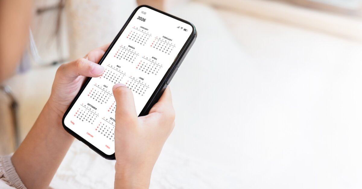 mobile HRMS app - person holding phone